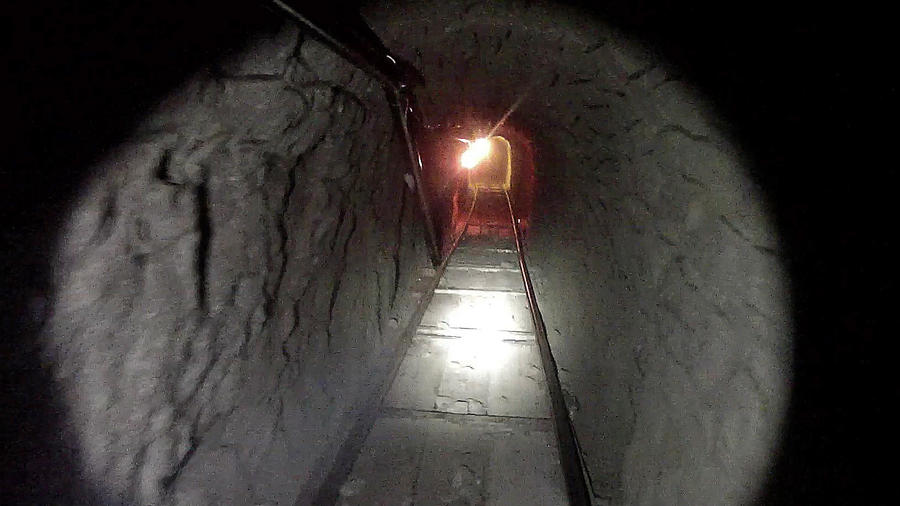 Tunnel Vision on the border This Oct. 30, 2013, photo released by U.S. Immigration and Customs Enforcement shows a tunnel linking warehouses in Tijuana and San Diego to smuggle drugs. The tunnel was equipped with electricity, ventilation and a rail system, U.S. authorities said. (Associated Press)